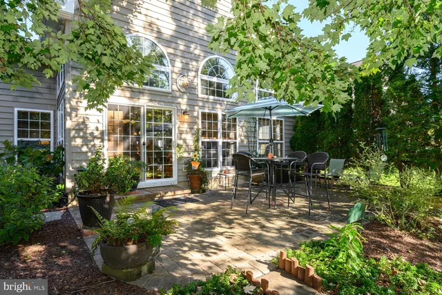 a view of a house with backyard porch and sitting area