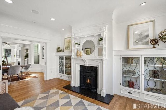 a bedroom with bed and wooden floor