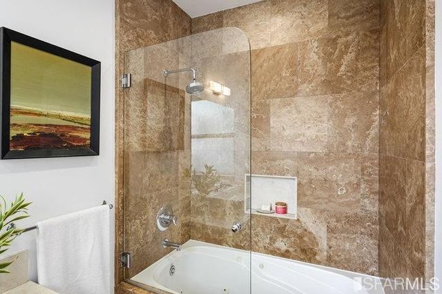 a view of a patio with table and chairs and potted plants