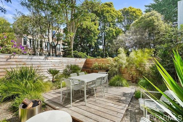 a view of a balcony with yard