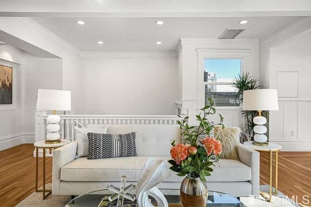 a living room with fireplace furniture and a fireplace