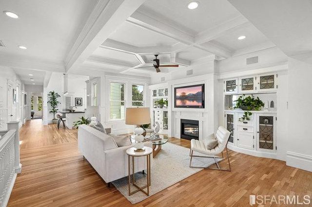 a kitchen with stainless steel appliances granite countertop a sink a stove and refrigerator