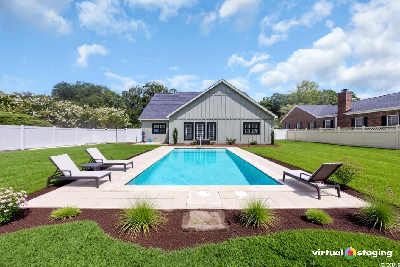 View of pool featuring a patio area and a fenced backyard