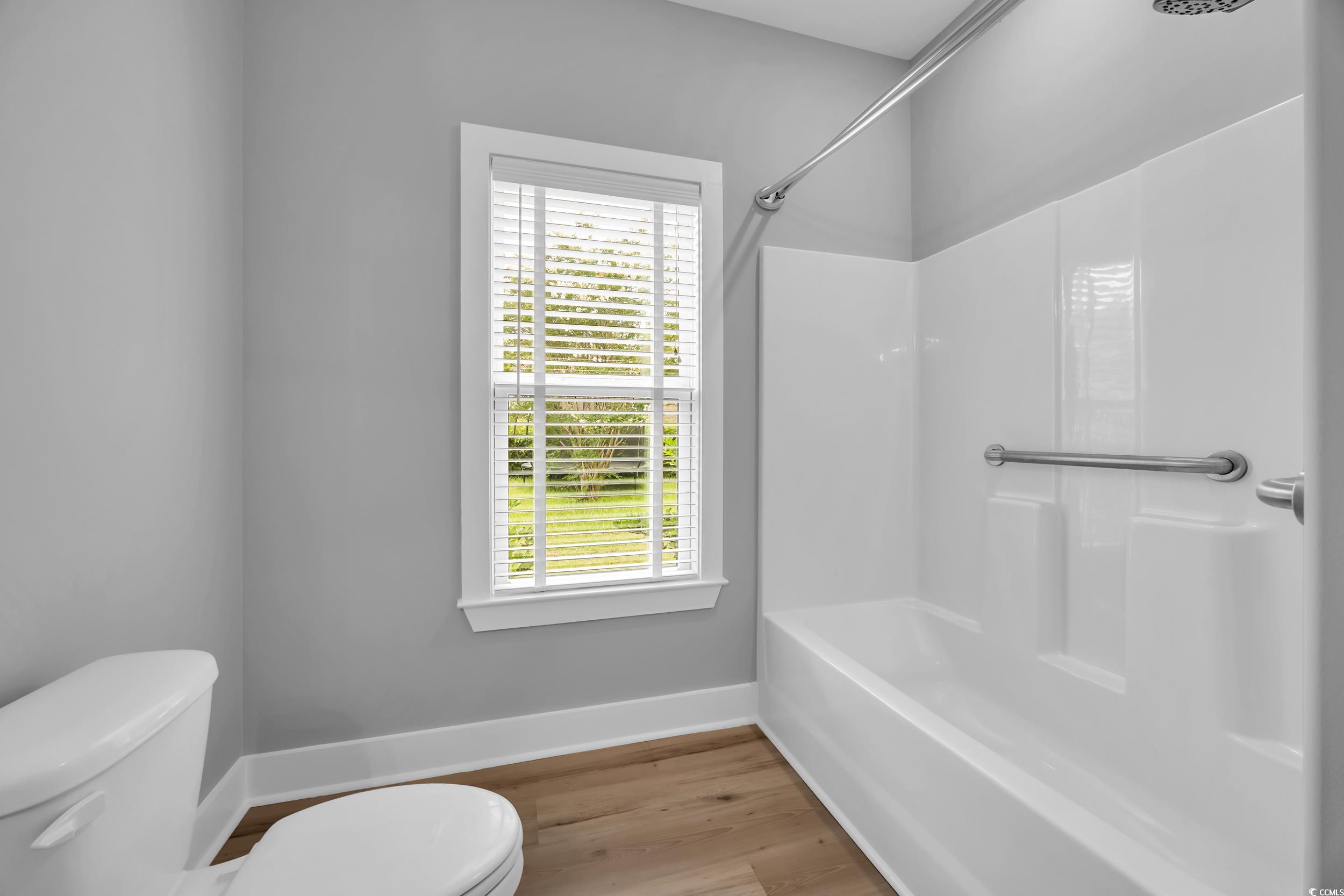 1121 Grimes Street Georgetown, SC 29440 - Photo 16 of 27 Unfurnished living room featuring a ceiling fan, light wood-style floors, recessed lighting, and a brick fireplace