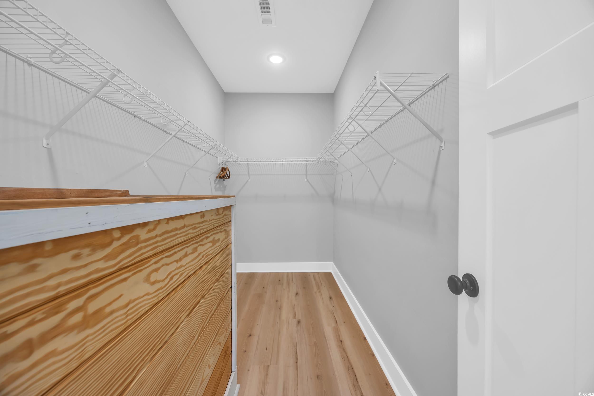 1121 Grimes Street Georgetown, SC 29440 - Photo 21 of 27 Bathroom featuring a tile shower and wood finished floors