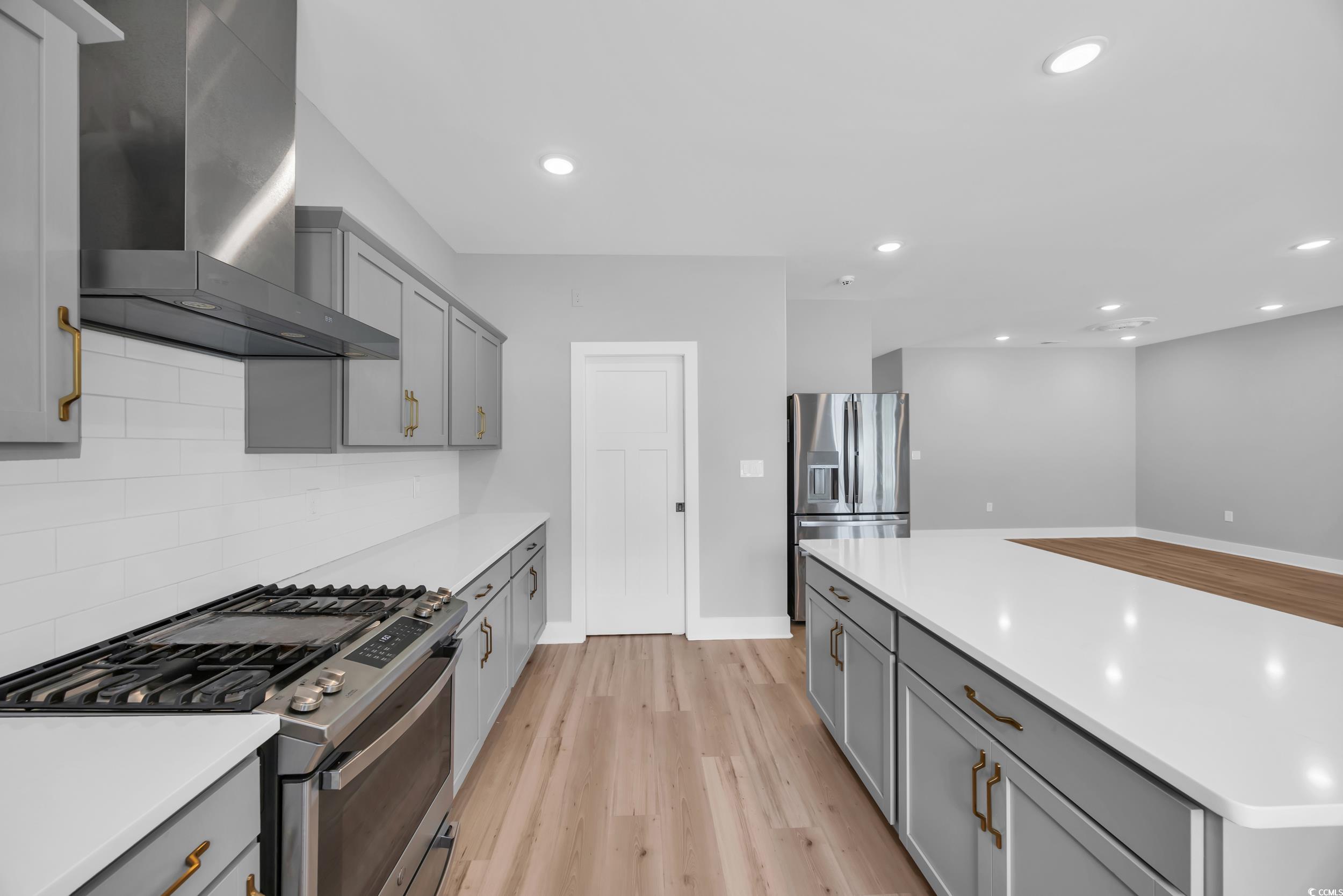 1121 Grimes Street Georgetown, SC 29440 - Photo 9 of 27 Kitchen featuring gray cabinetry, decorative backsplash, light countertops, and recessed lighting