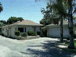 130 Toro Canyon Road Carpinteria, CA 93013 - Photo 1 of 1 a front view of a house with a yard