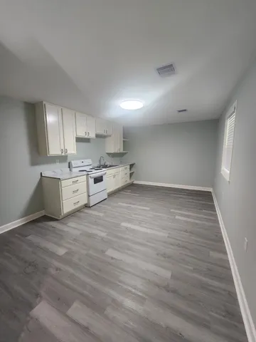 a view of kitchen and wooden floor