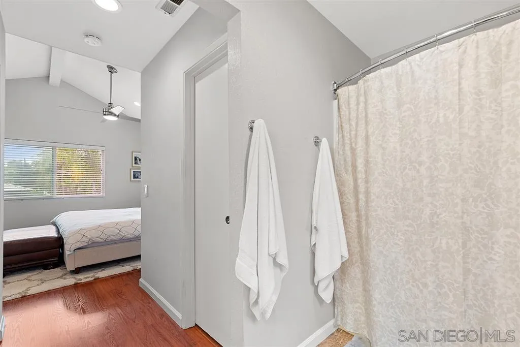 5673 Raintree Way Oceanside, CA 92057 - Photo 13 of 23 a view of a bedroom with furniture and a bed