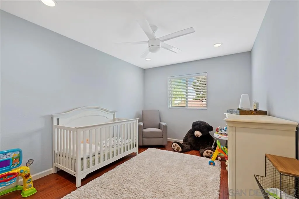 5673 Raintree Way Oceanside, CA 92057 - Photo 18 of 23 a bedroom with furniture and a window
