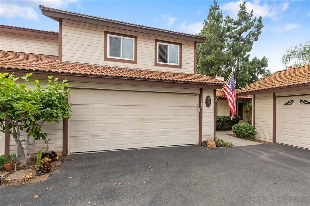 5673 Raintree Way Oceanside, CA 92057 - Photo 2 of 23 a front view of a house with a garage