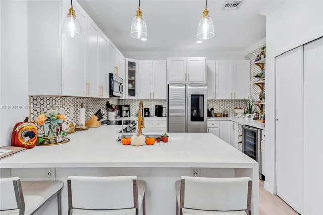 a view of a kitchen with appliances and cabinets