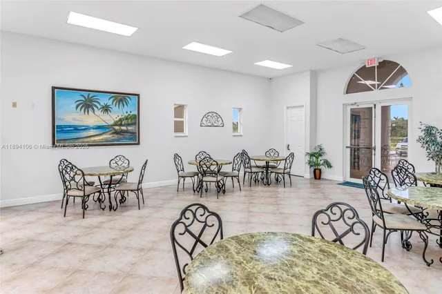 a view of a dining room and hall with furniture