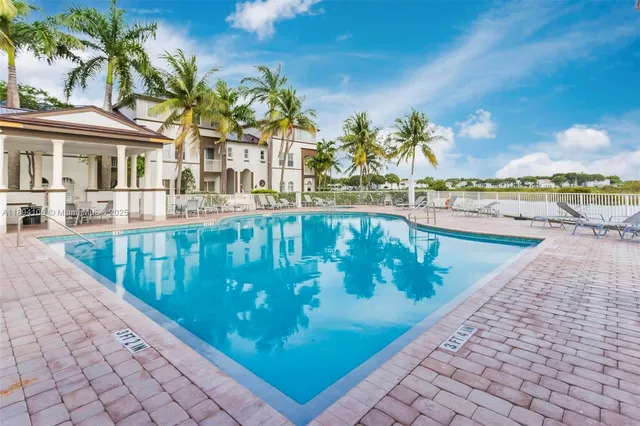 a view of a swimming pool with a patio