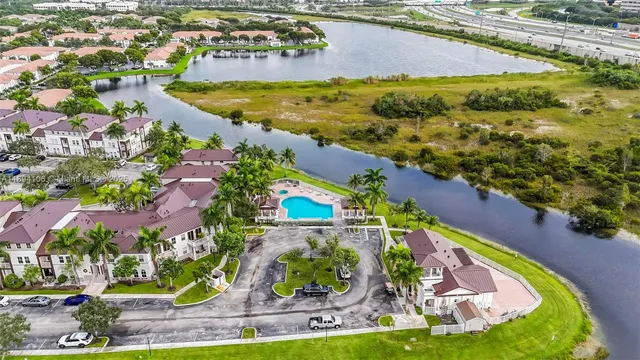 an aerial view of residential houses with outdoor space