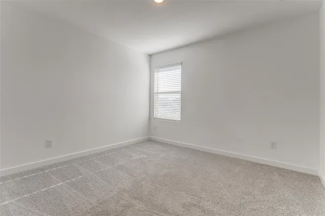 a front view of a house with yard and green space