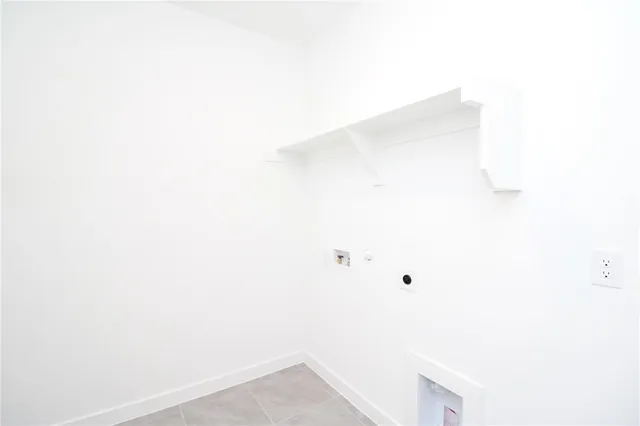 an empty room that has a window in it