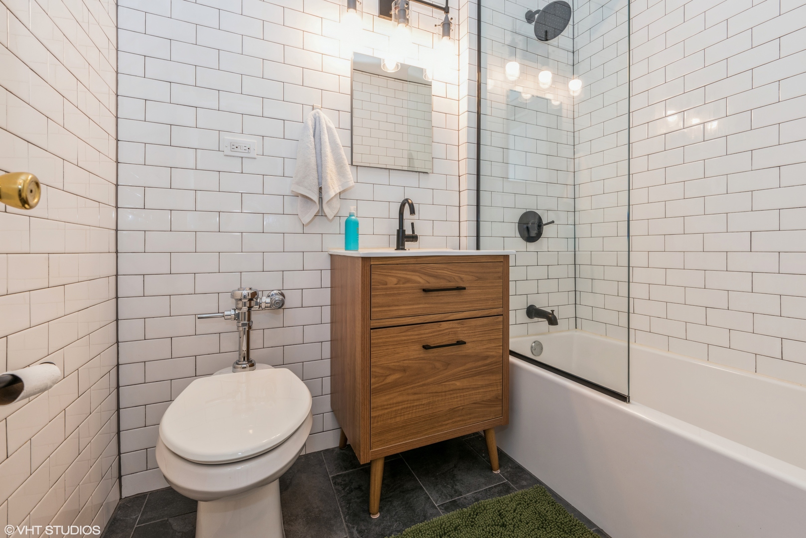 5801 North Sheridan Road, Unit 16E Chicago, IL 60660 - Photo 11 of 12 a bathroom with a sink a toilet and shower