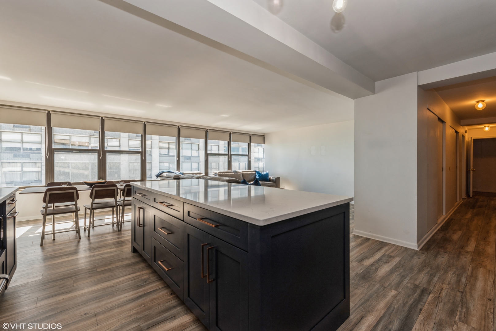 5801 North Sheridan Road, Unit 16E Chicago, IL 60660 - Photo 6 of 12 a kitchen with counter top space and wooden floor