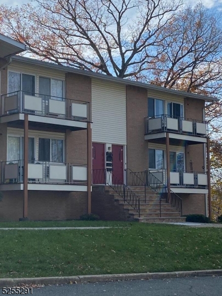 156 Highway 46, Unit 22 Rockaway, NJ 07866 - Photo 2 of 10 a view of a house with a yard