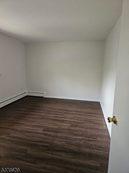 156 Highway 46, Unit 22 Rockaway, NJ 07866 - Photo 8 of 10 a view of wooden floor with wooden floor