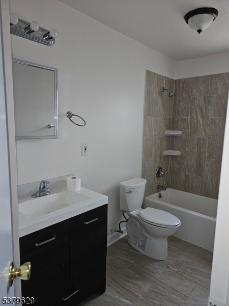 156 Highway 46, Unit 22 Rockaway, NJ 07866 - Photo 9 of 10 a bathroom with a sink toilet a mirror and shower