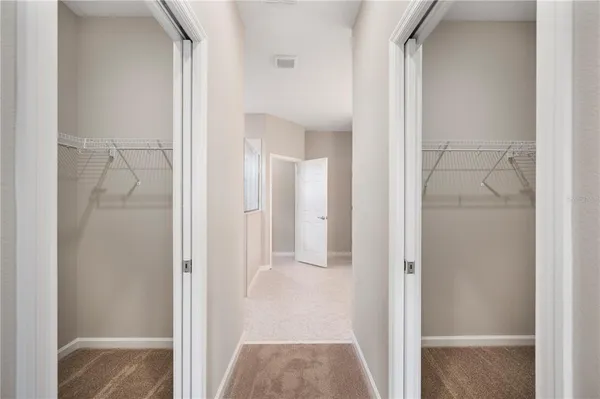 a view of a bathroom from a hallway