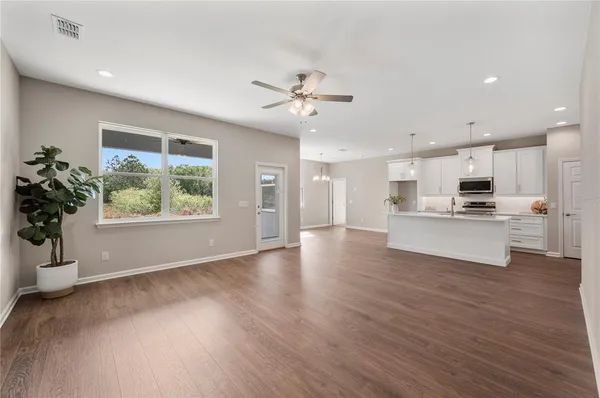 a view of kitchen with wooden floor and window