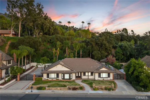 a view of a house with swimming pool