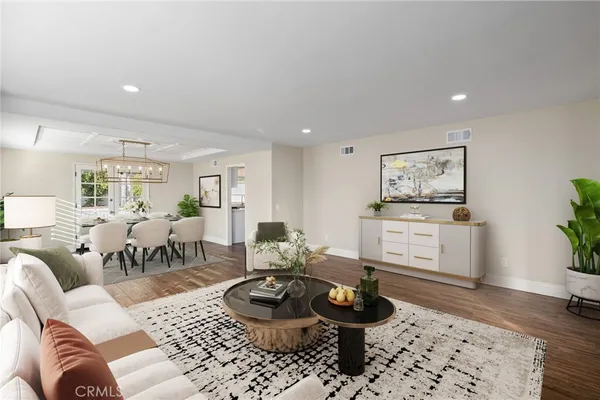 a kitchen with a sink cabinets stainless steel appliances and a window