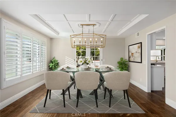 a kitchen with granite countertop white cabinets stainless steel appliances and sink