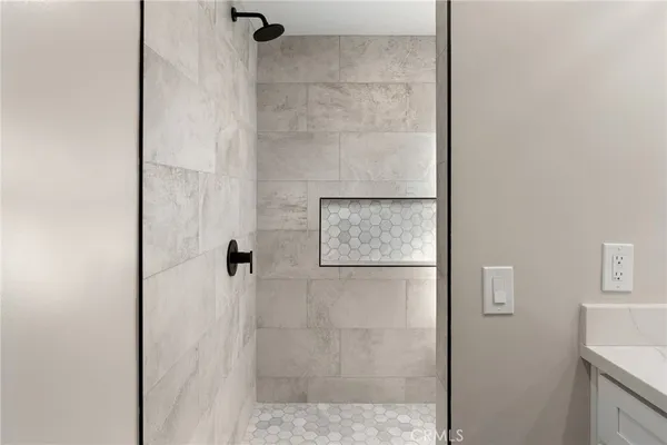 a bedroom with bed and a window