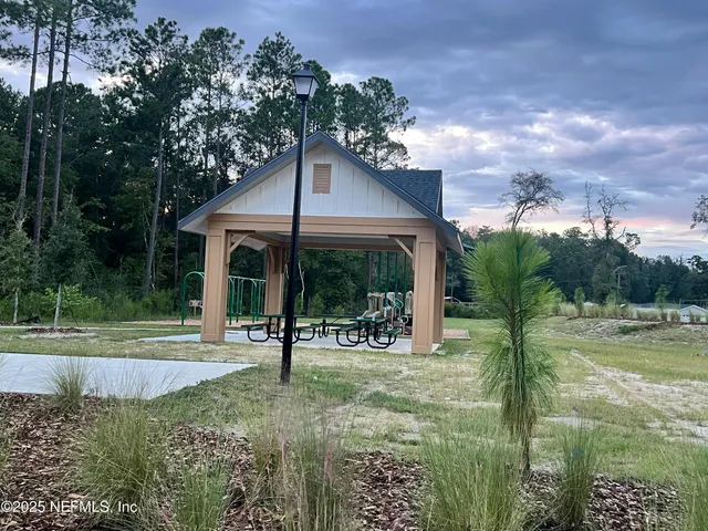 a view of a lake with a yard