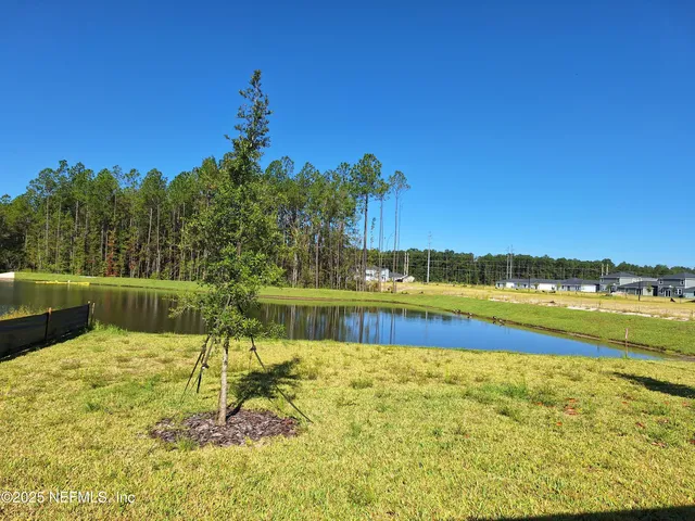 a view of swimming pool with a yard