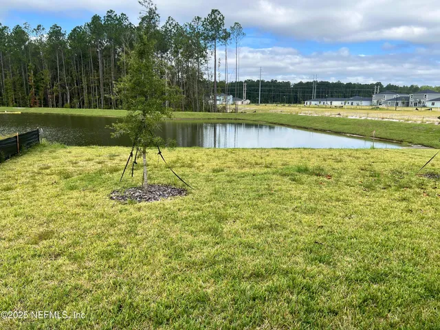 a view of a lake with a big yard