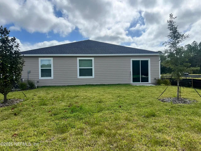 a house with garden in front of it