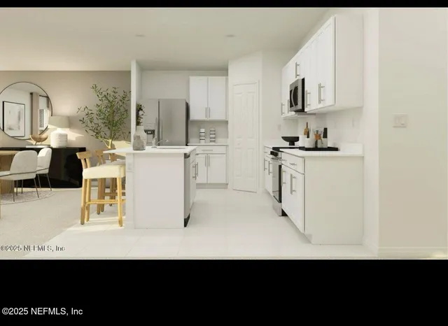 a view of kitchen with cabinets microwave and stove