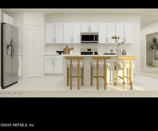a view of kitchen with microwave and cabinets