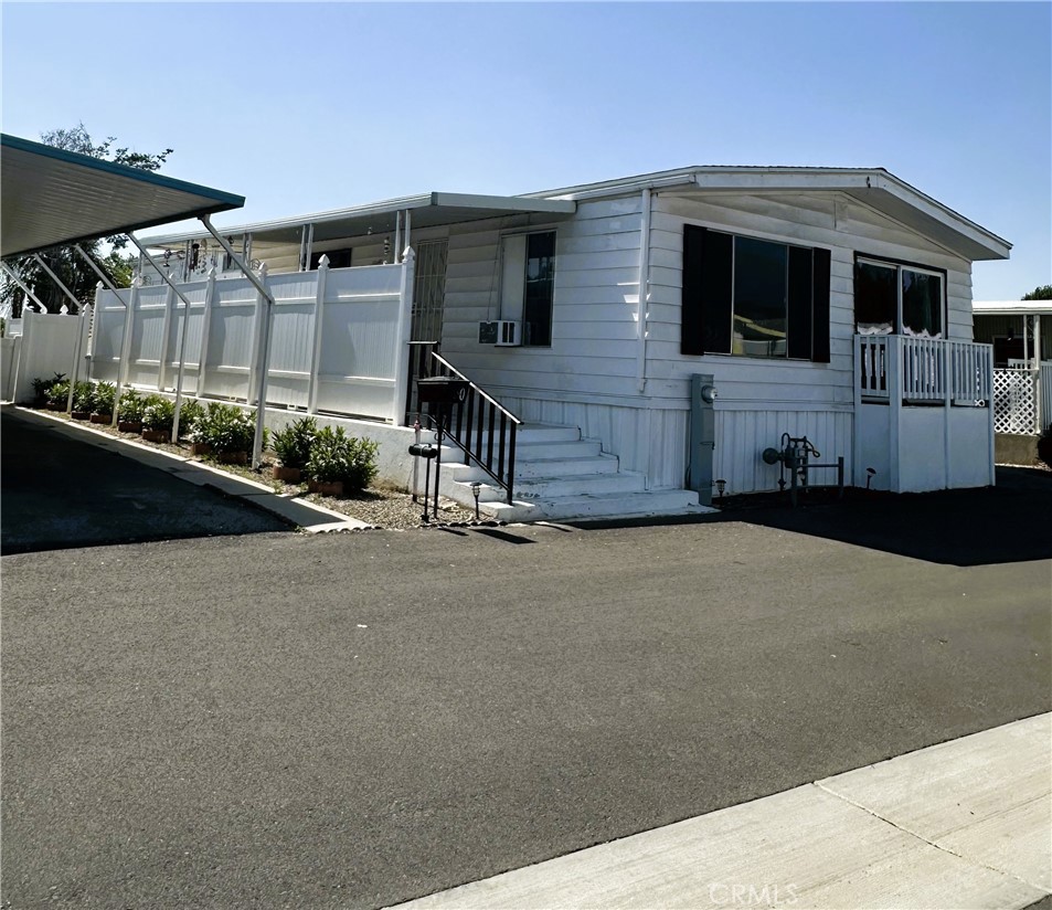 950 California Street, Unit 60 Calimesa, CA 92320 - Photo 1 of 26 a front view of a house with garage