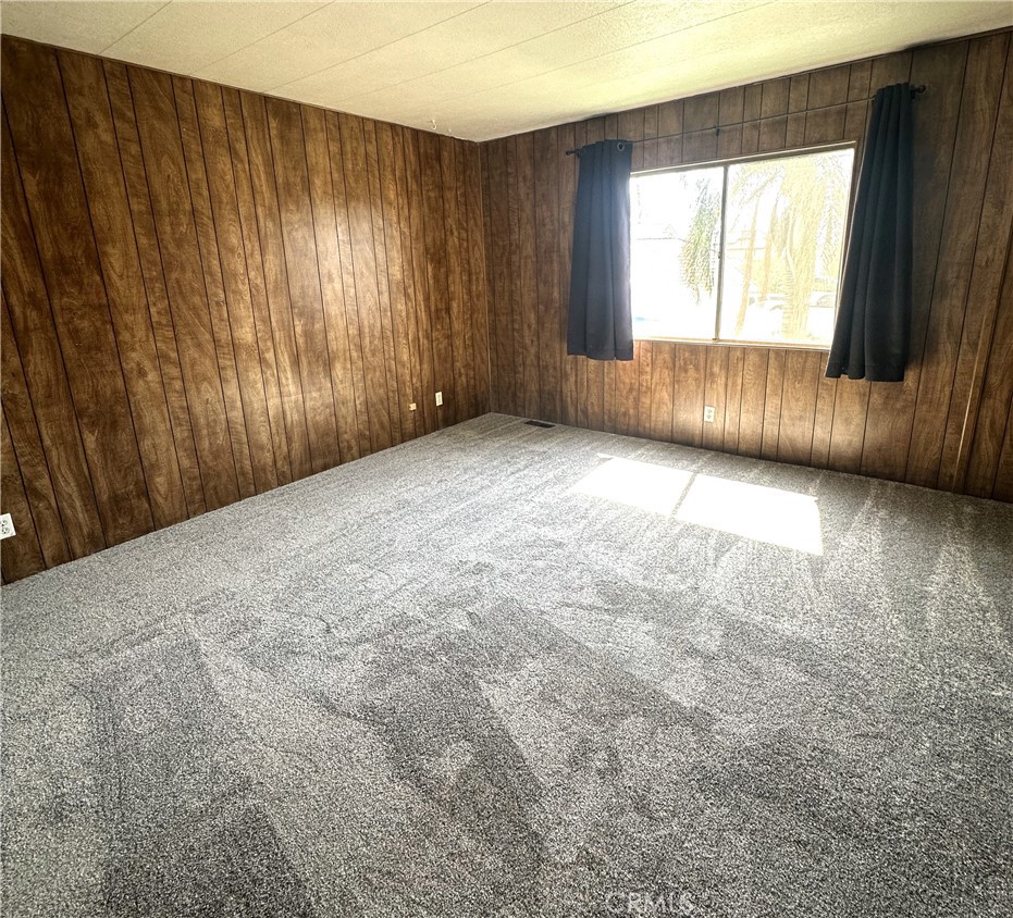 950 California Street, Unit 60 Calimesa, CA 92320 - Photo 14 of 26 an empty room with windows