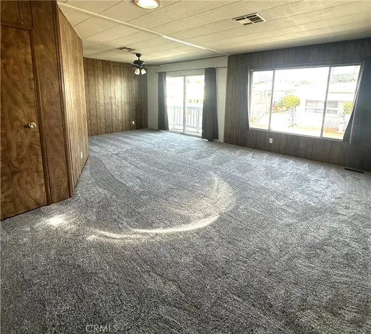 a view of a hallway with windows