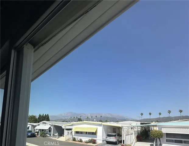 a view of a chairs and table in patio