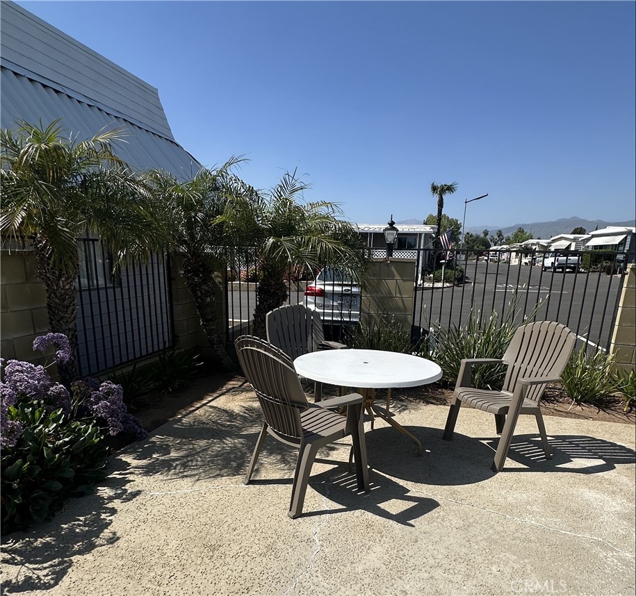 950 California Street, Unit 60 Calimesa, CA 92320 - Photo 22 of 26 a view of a chairs and table in patio