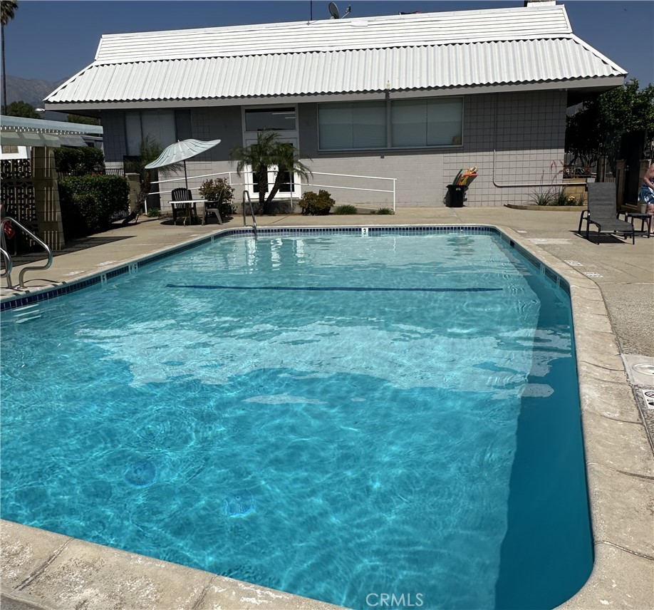 950 California Street, Unit 60 Calimesa, CA 92320 - Photo 23 of 26 a view of a house with backyard space and sitting area