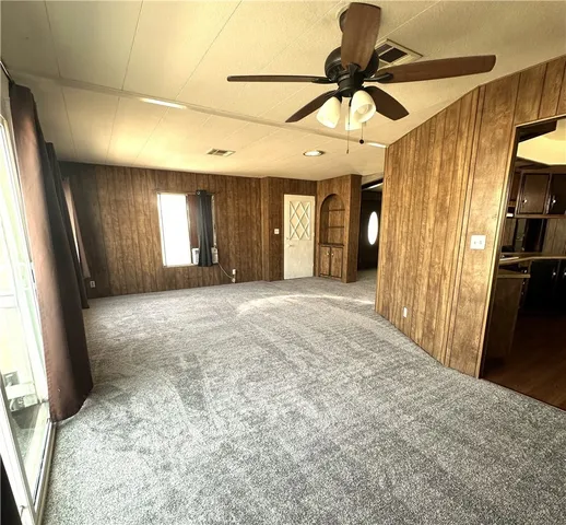 a view of a livingroom with a furniture and a chandelier