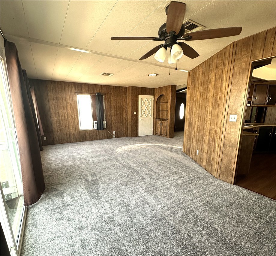 950 California Street, Unit 60 Calimesa, CA 92320 - Photo 3 of 26 a view of a livingroom with a furniture and a chandelier