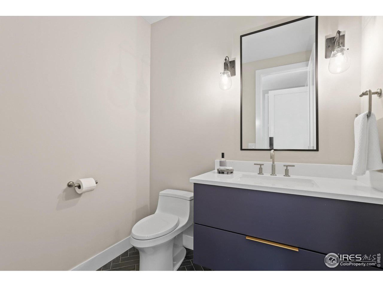 3063 7th Street Boulder, CO 80304 - Photo 15 of 39 a bathroom with a sink a toilet and mirror