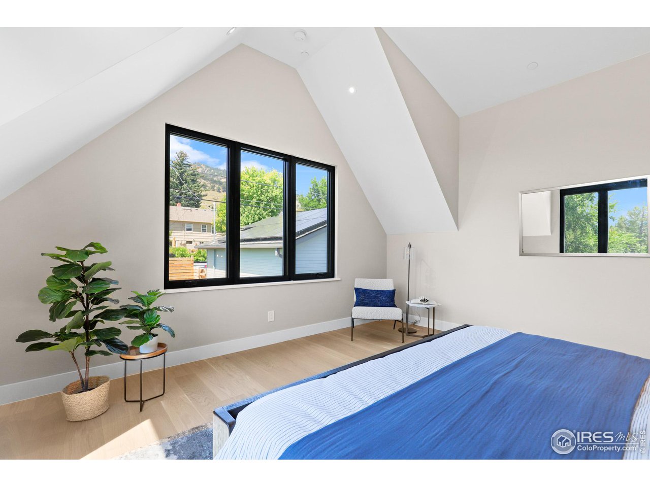 3063 7th Street Boulder, CO 80304 - Photo 18 of 39 a living room with wooden floor and a potted plant