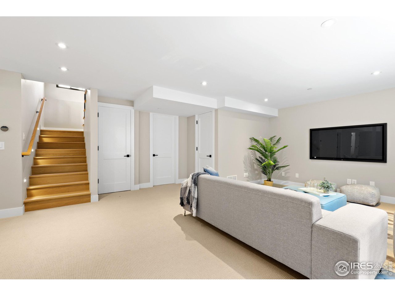 3063 7th Street Boulder, CO 80304 - Photo 25 of 39 a living room with a couch and a flat screen tv