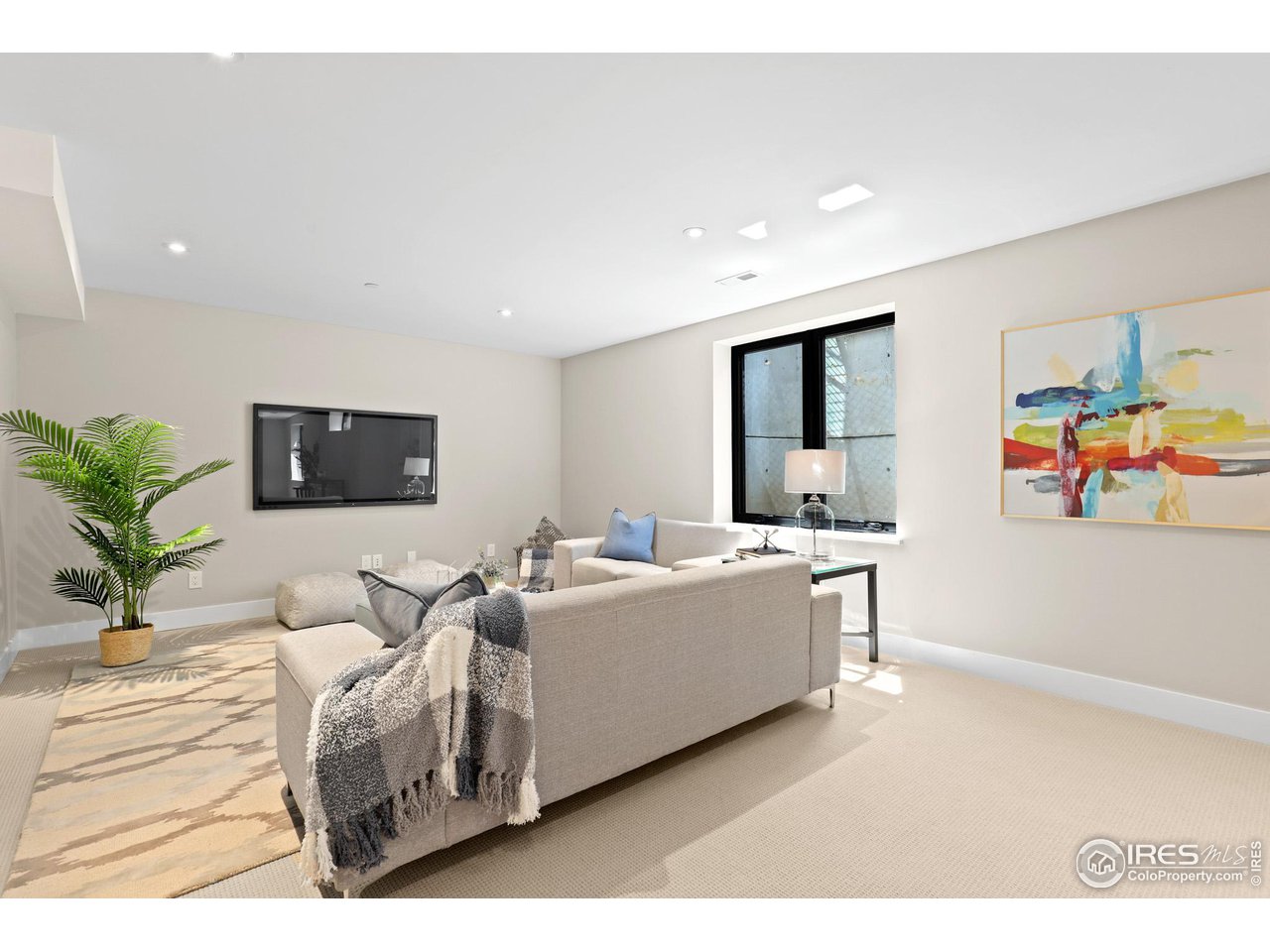 3063 7th Street Boulder, CO 80304 - Photo 26 of 39 a living room with furniture and a flat screen tv